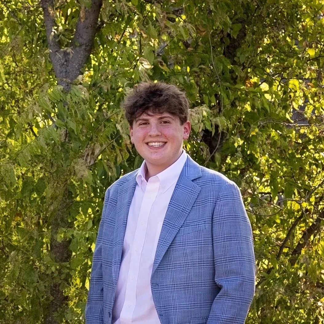 Luke Nordin, founder of Mountline, outdoors in a blue checked jacket